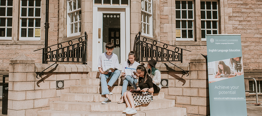 Students sitting on step at Paterson's Land