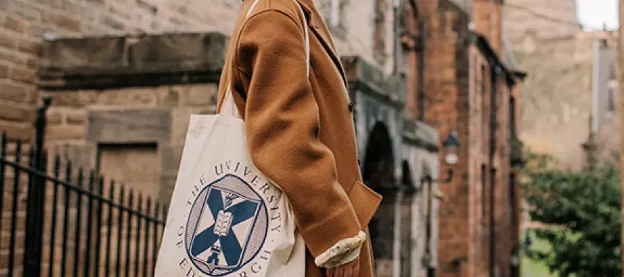 Student with University of Edinburgh tote bag