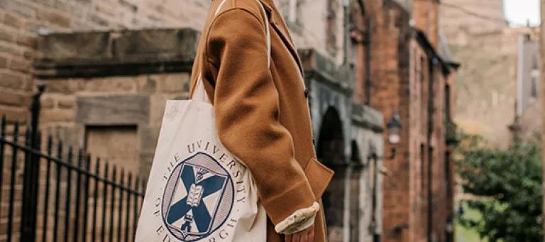 Student with University of Edinburgh tote bag